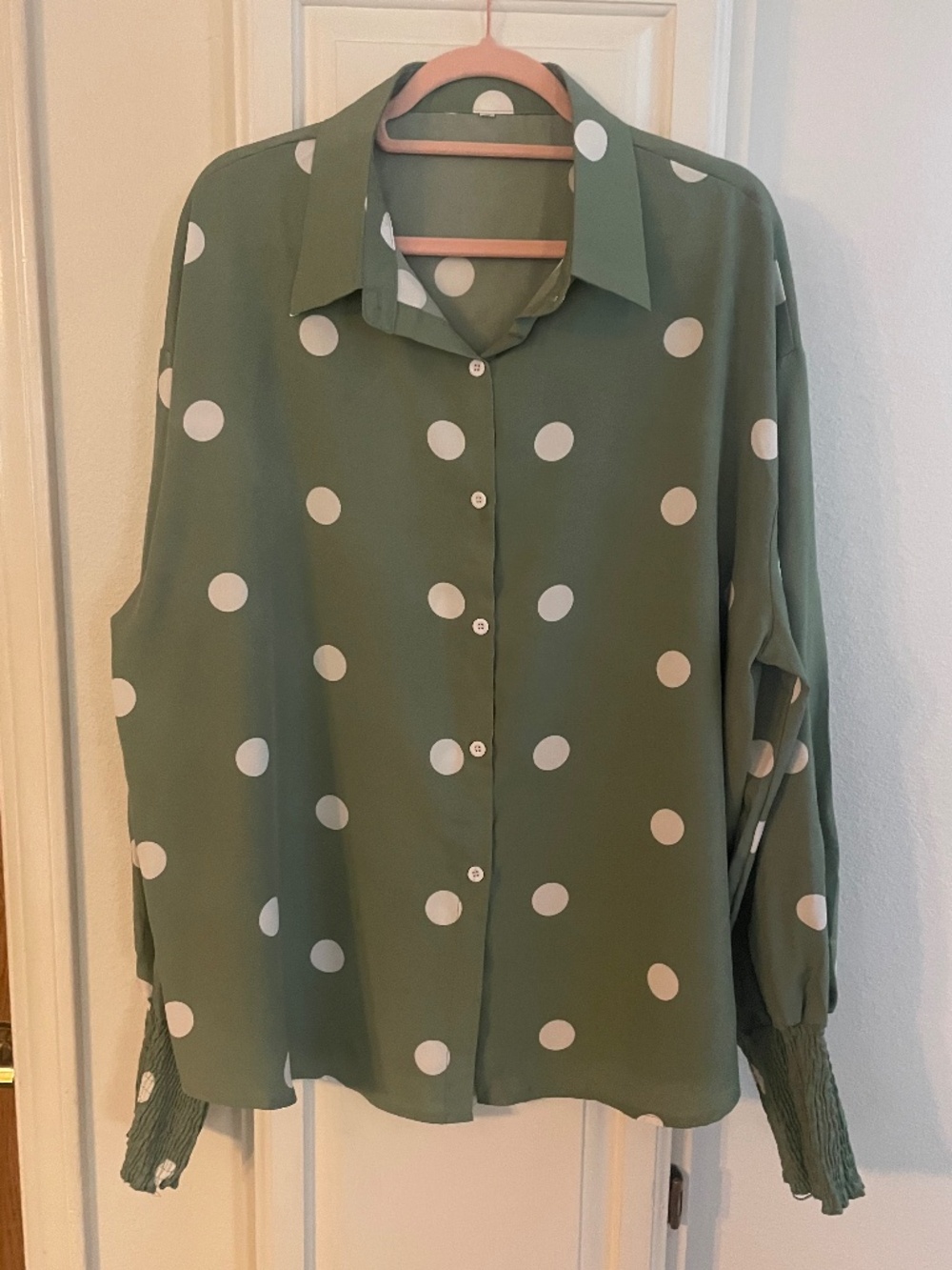 Polka dotted green and white blouse